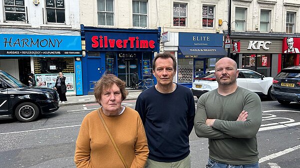 Lib dem councillors and campaigners outside silvertime gambling shop in earls court